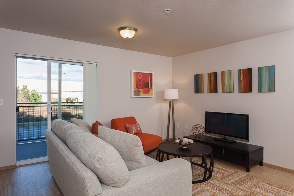 a living room with a couch and a tv