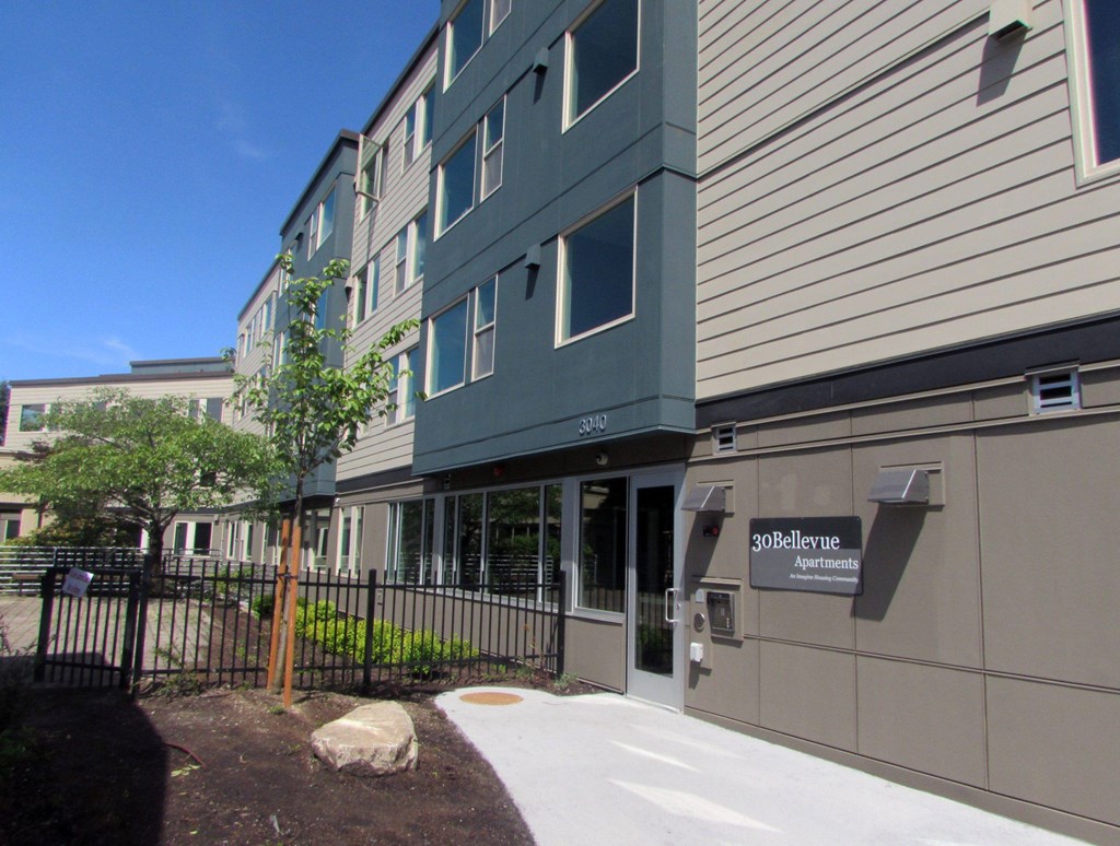 The image shows a building with the name "30Bellevue" on its facade.
