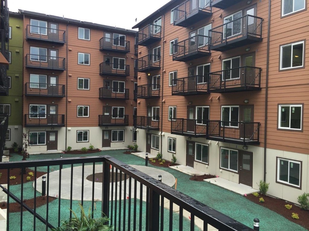 a view of an apartment building from a balcony