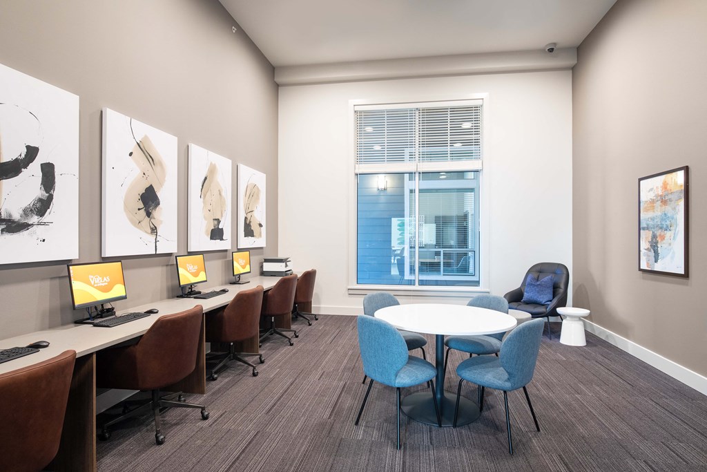 a conference room with a table and chairs and a window