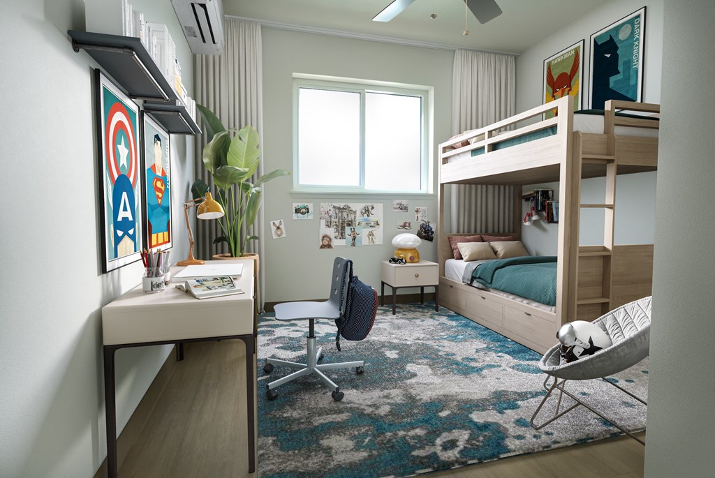 A room with a bunk bed, a desk, and a chair.