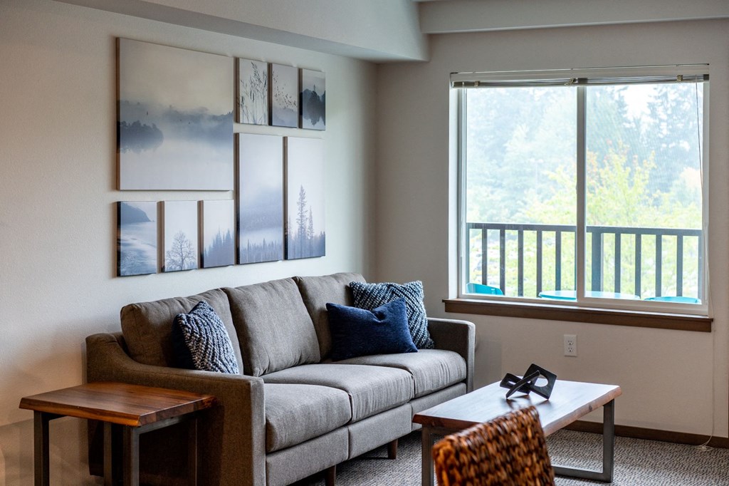 a living room with a couch and a window