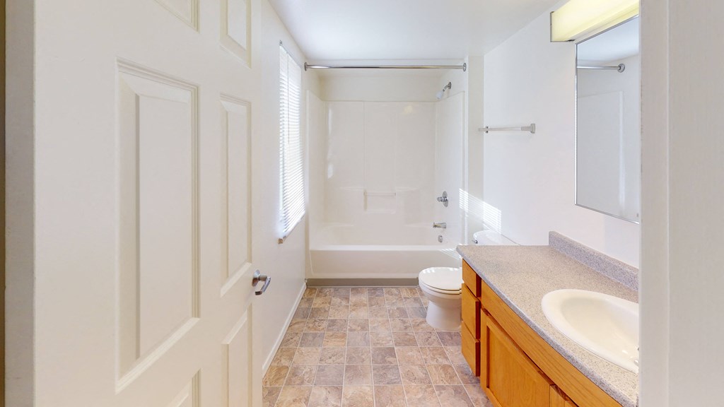 a bathroom with a toilet and a sink