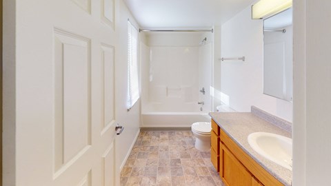 a bathroom with a toilet and a sink