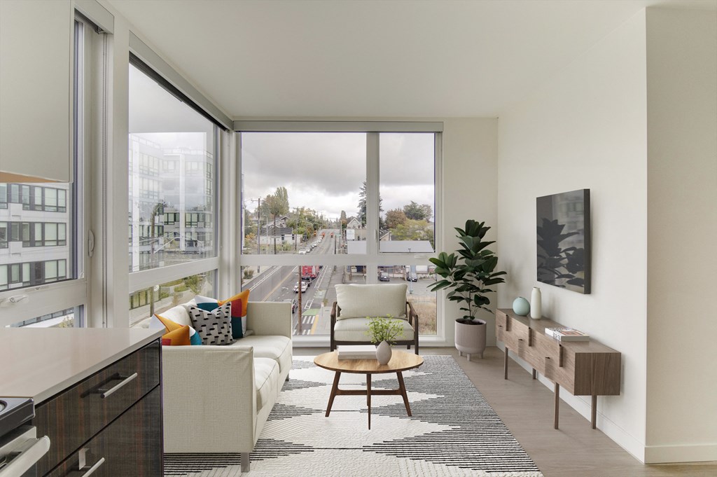 a living room with a large window and a view of the city