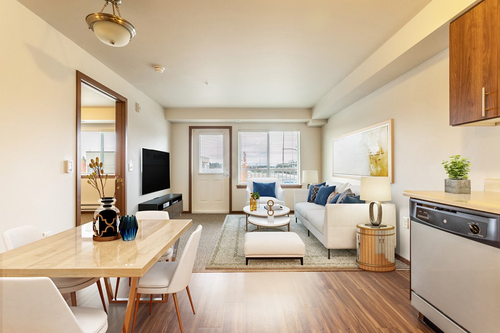 a living room with a couch and a table and a tv