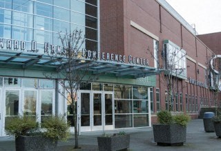 the front of a building with a glass facade