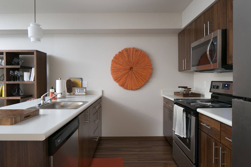 a kitchen with stainless steel appliances and a counter top