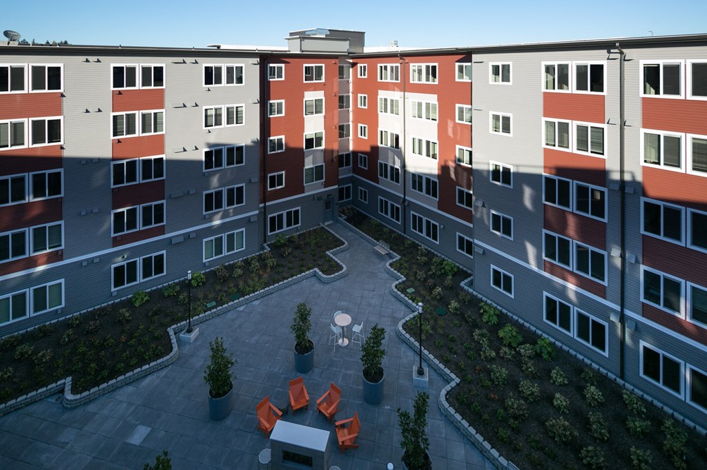 an aerial view of an apartment complex with a courtyard