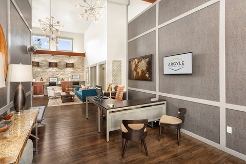 A modern dining room with a Argyle sign on the wall.