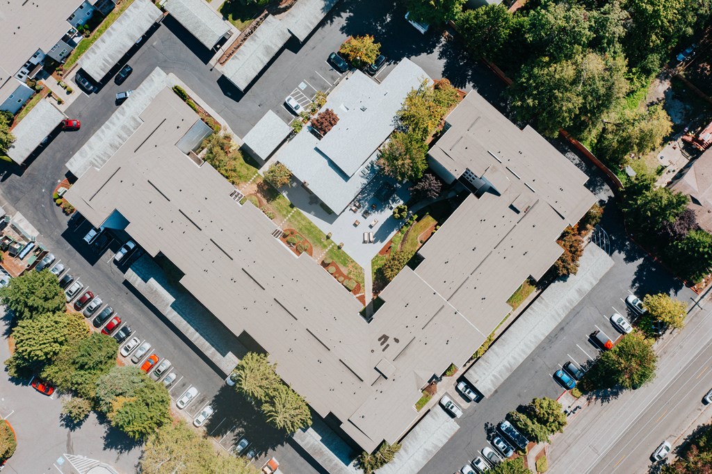 an aerial view of roofs of buildings in a city