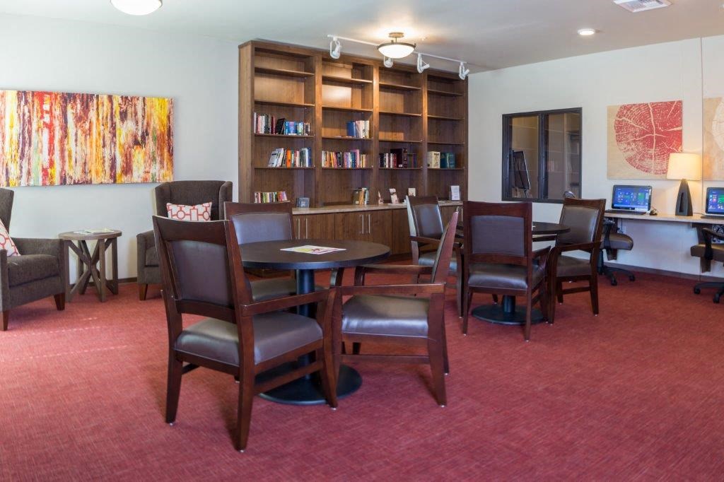 a conference room with a table and chairs