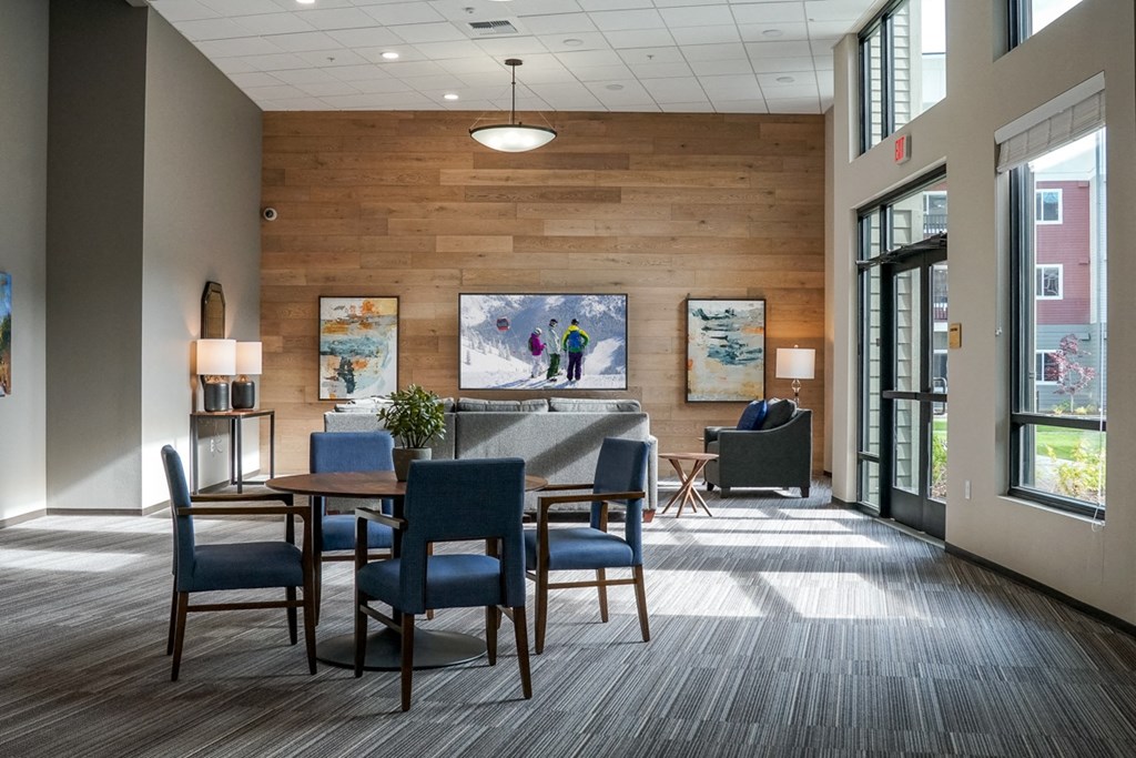 a dining room with a table and chairs in a lobby