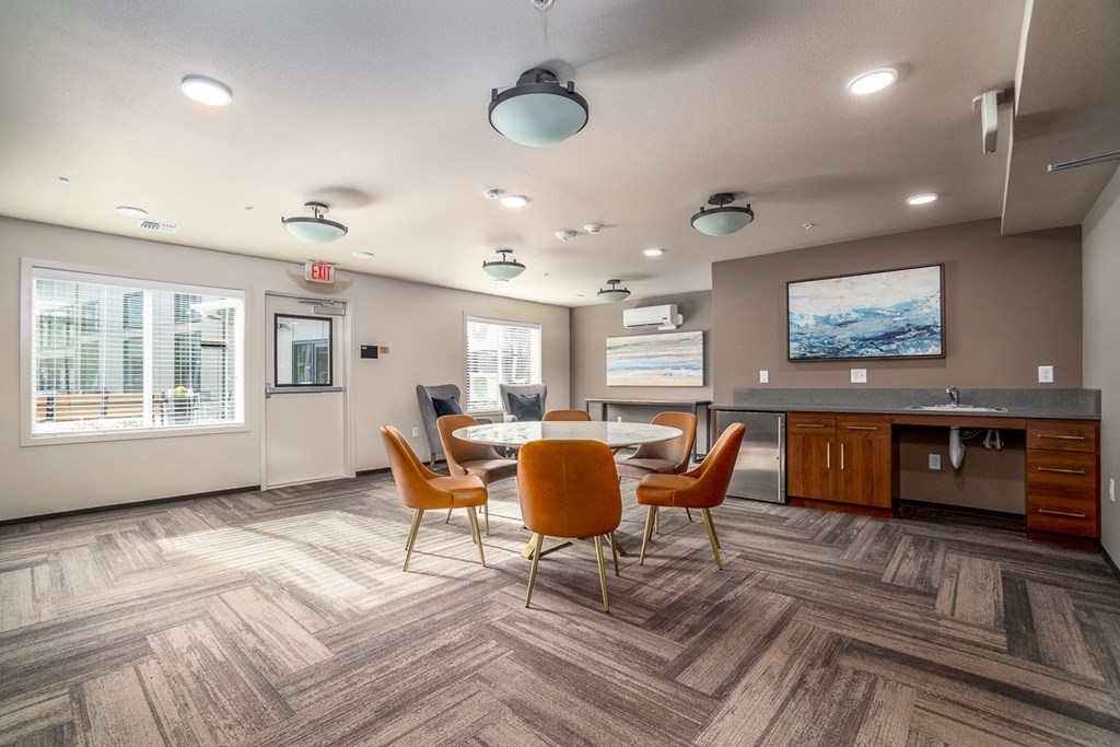the preserve at ballantyne commons community room with table and chairs
