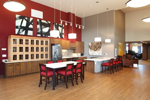 an open kitchen and dining room with a table and chairs