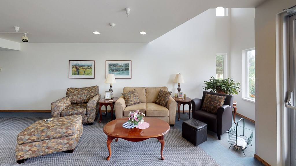 a living room with couches chairs and a coffee table
