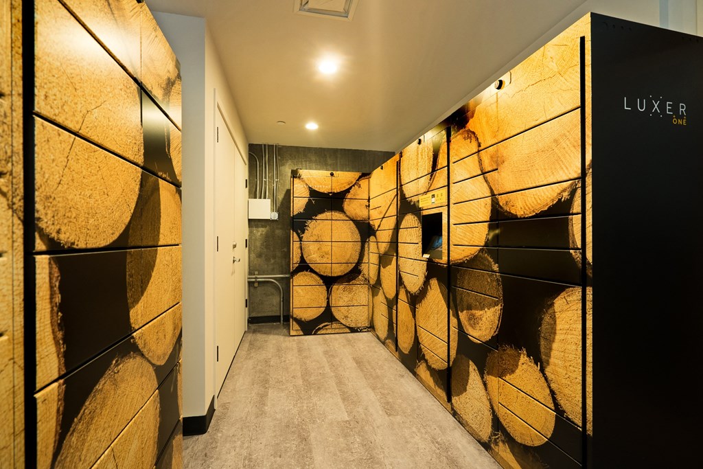 a hallway with a painting on the wall and a door