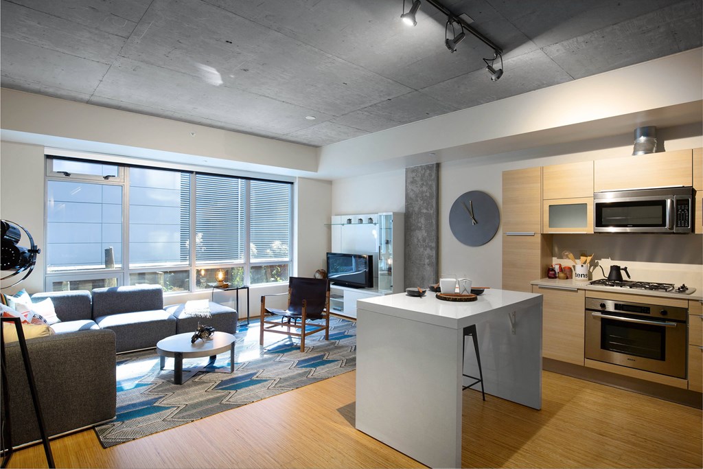 a rendering of a living room and kitchen in an apartment