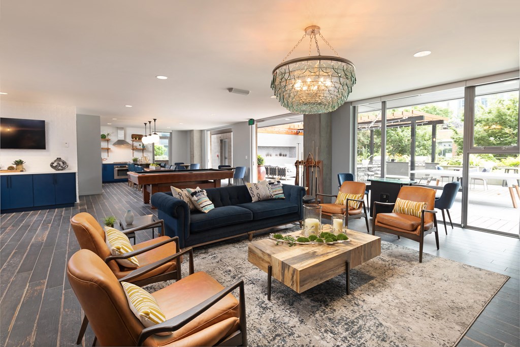 a living room with couches and chairs and a table