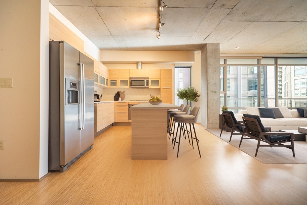 a kitchen and living room in a condominium
