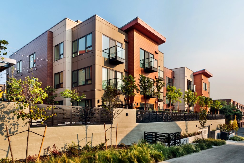 a row of modern apartment buildings on a city street