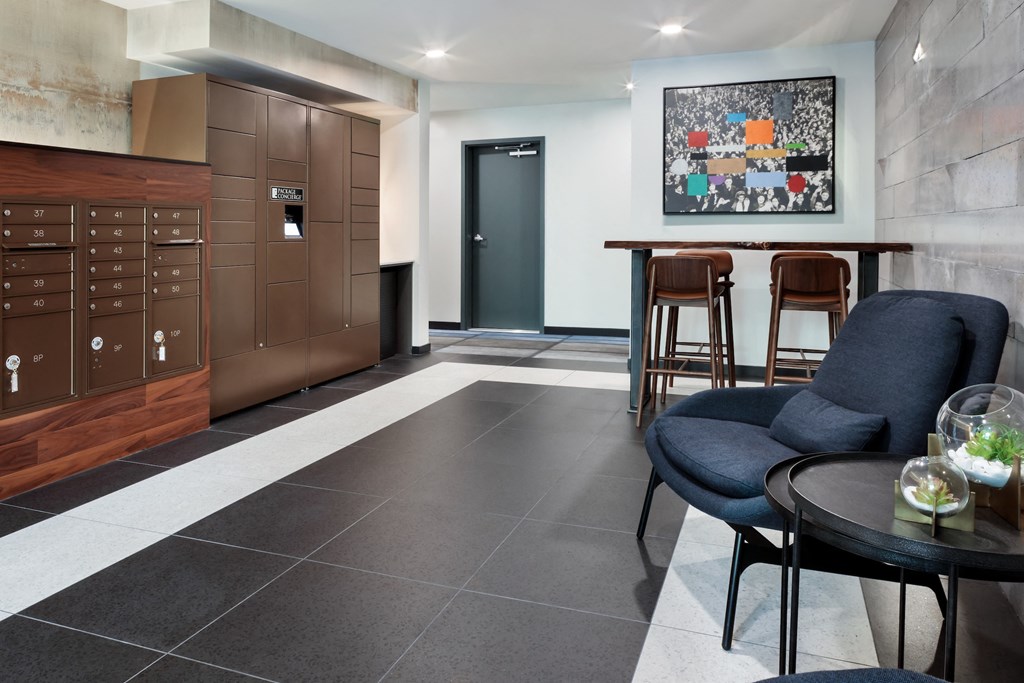 a living room with a kitchen and a table and chairs
