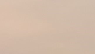 the sky is brown and cloudy