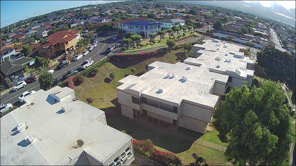 an aerial view of a large building in a city