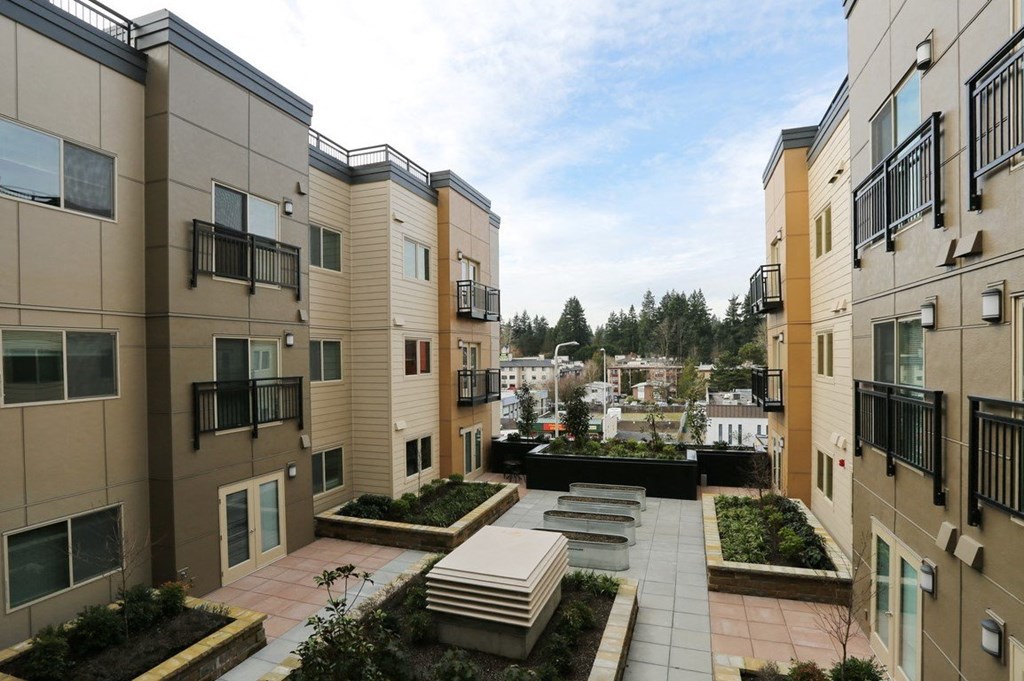 a view of a courtyard in a new apartment building