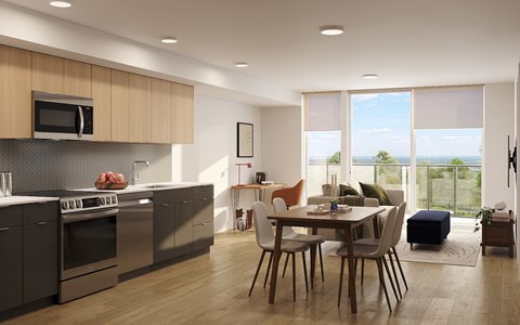 A modern kitchen with a dining table and chairs.