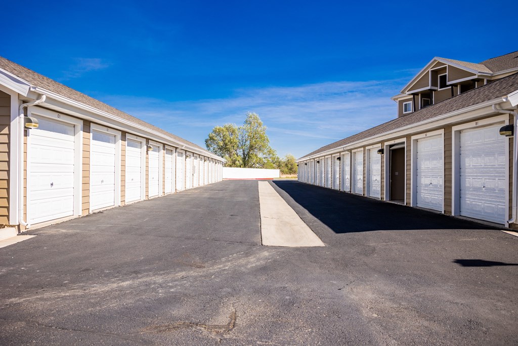 A long row of garage doors are closed.