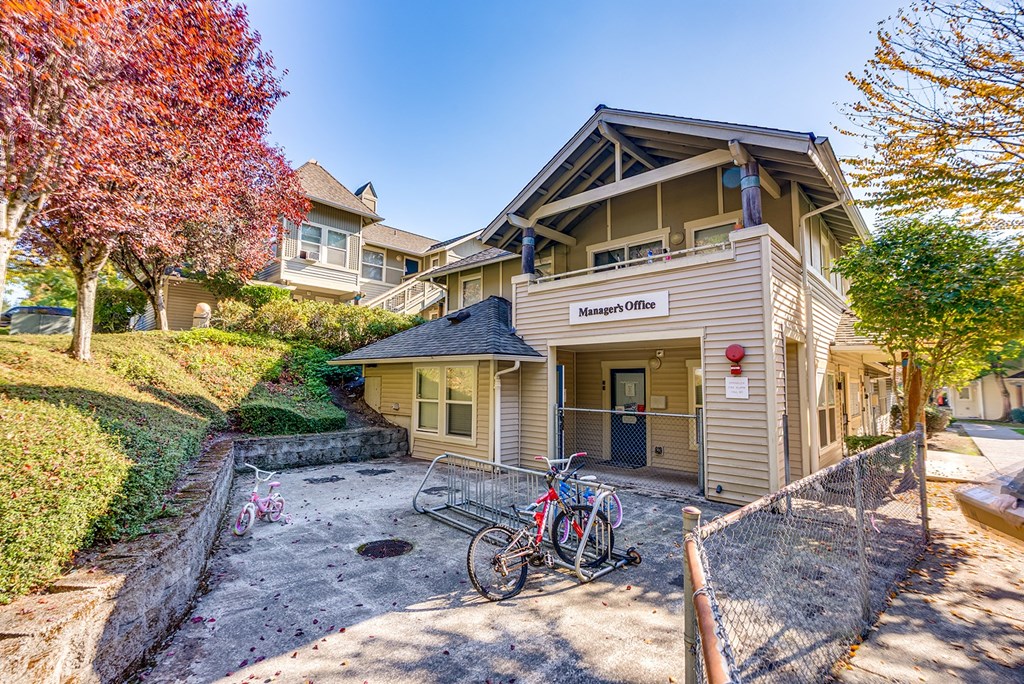 A house with a sign that says "Manager's Office" on the front.