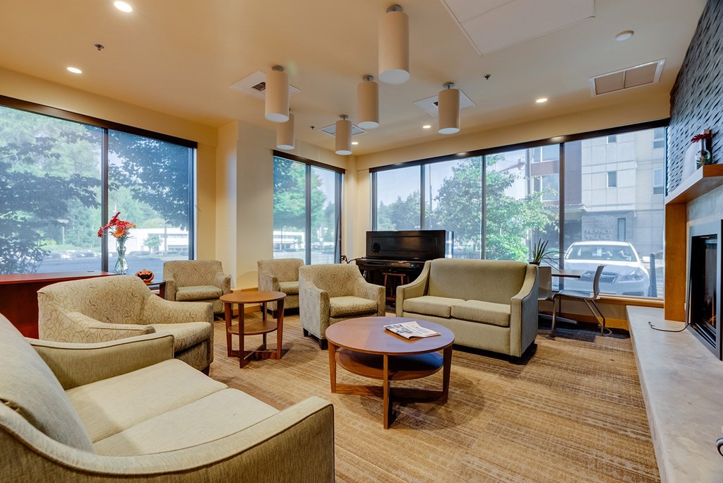 A living room with a fireplace and a flat screen TV.