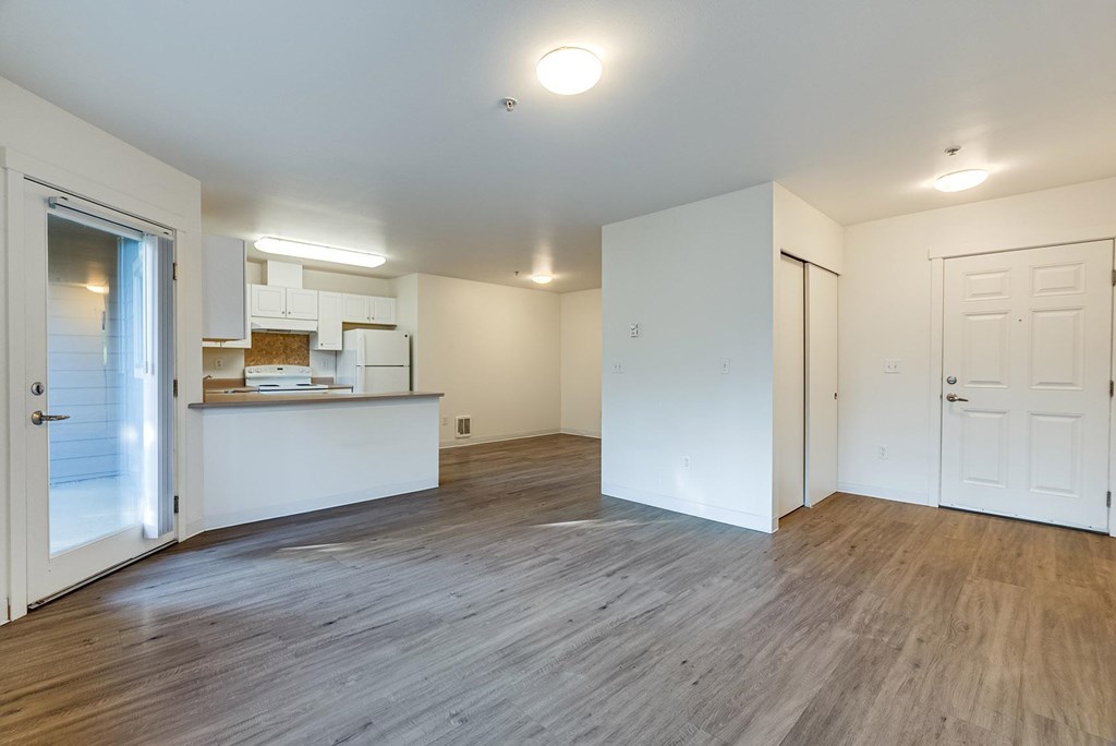 A kitchen area with a counter and cabinets.