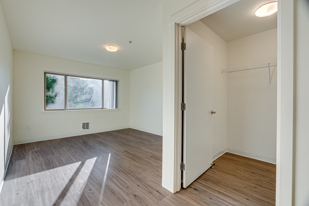 A room with a door and a window.