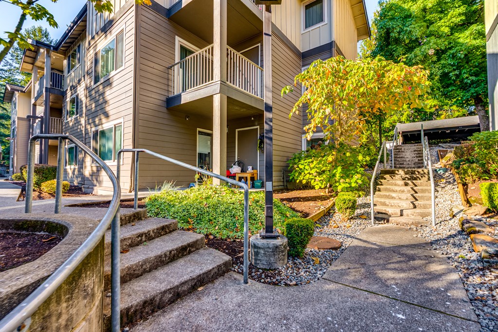 A building with a staircase leading to a balcony.