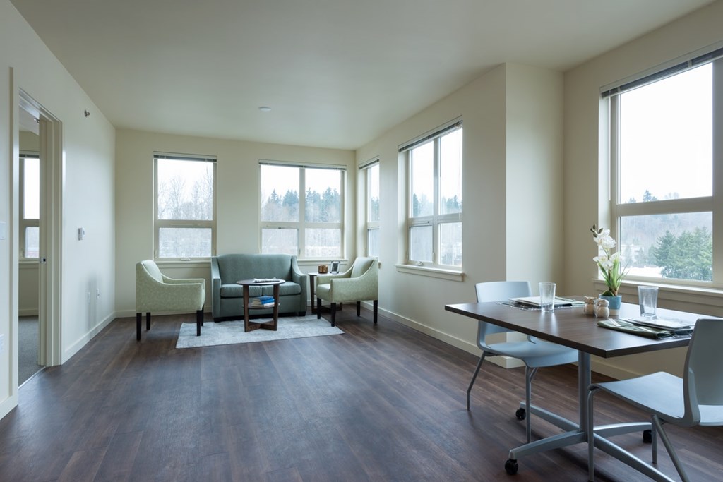 A room with a table and chairs in it.