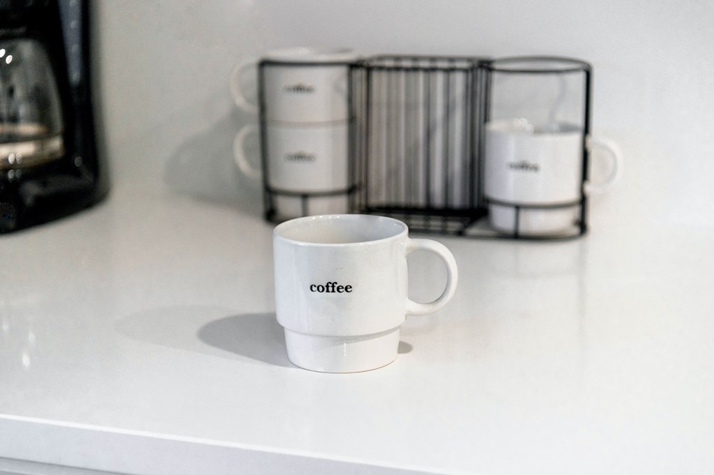 a coffee mug sitting on a kitchen counter