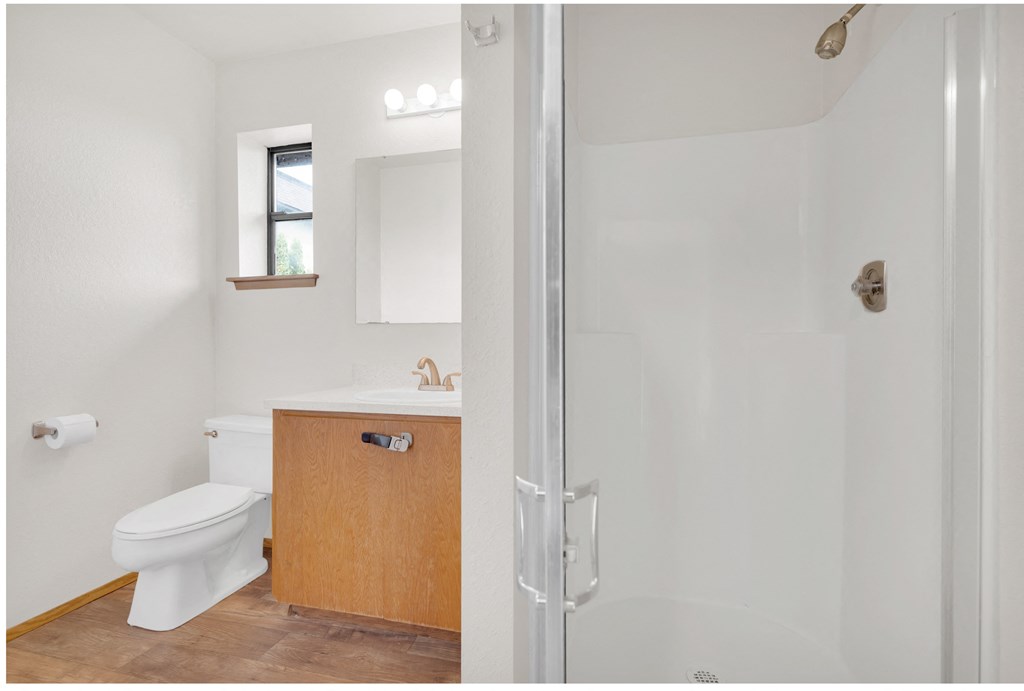 a small bathroom with a toilet and a shower