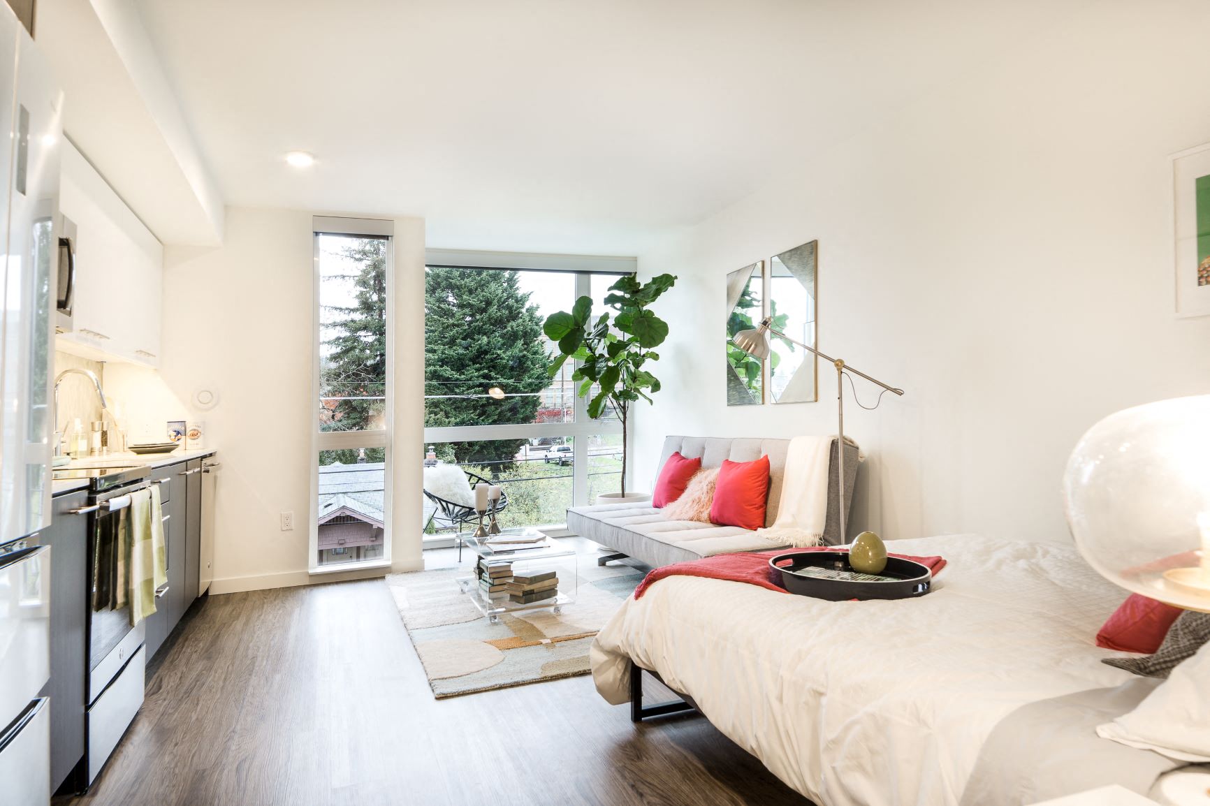 a bedroom with a bed and a living room