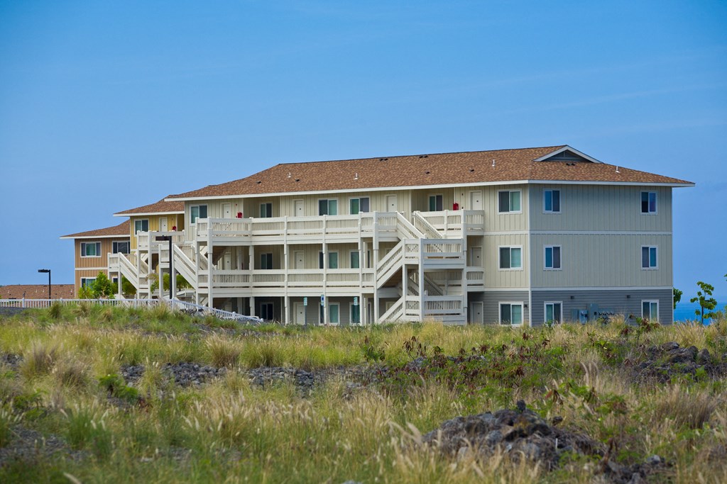 an image of an apartment building on the beach