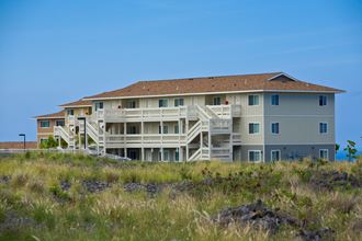 a view of the back of the house from the beach