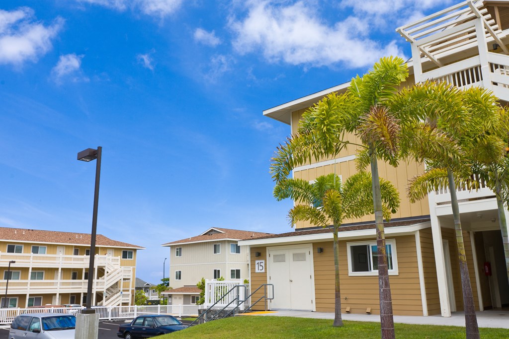 a building with palm trees in front of it