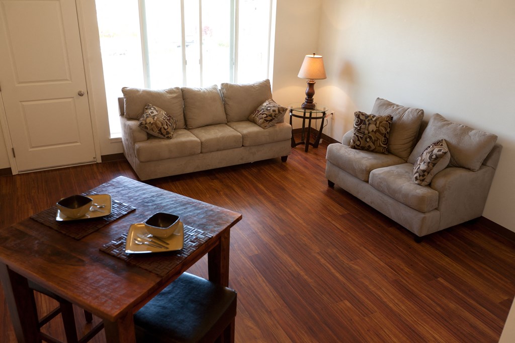a living room with couches and a coffee table