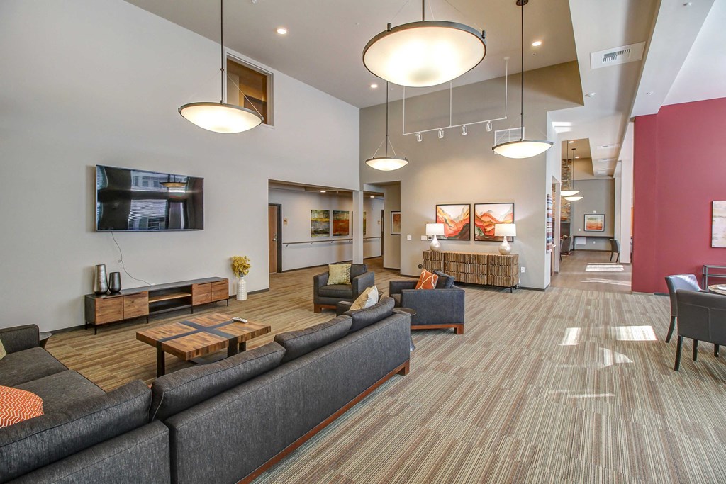 a large living room with couches and a table