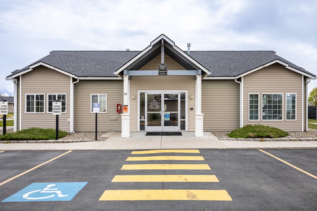the front of a building with a cross walk in front of it