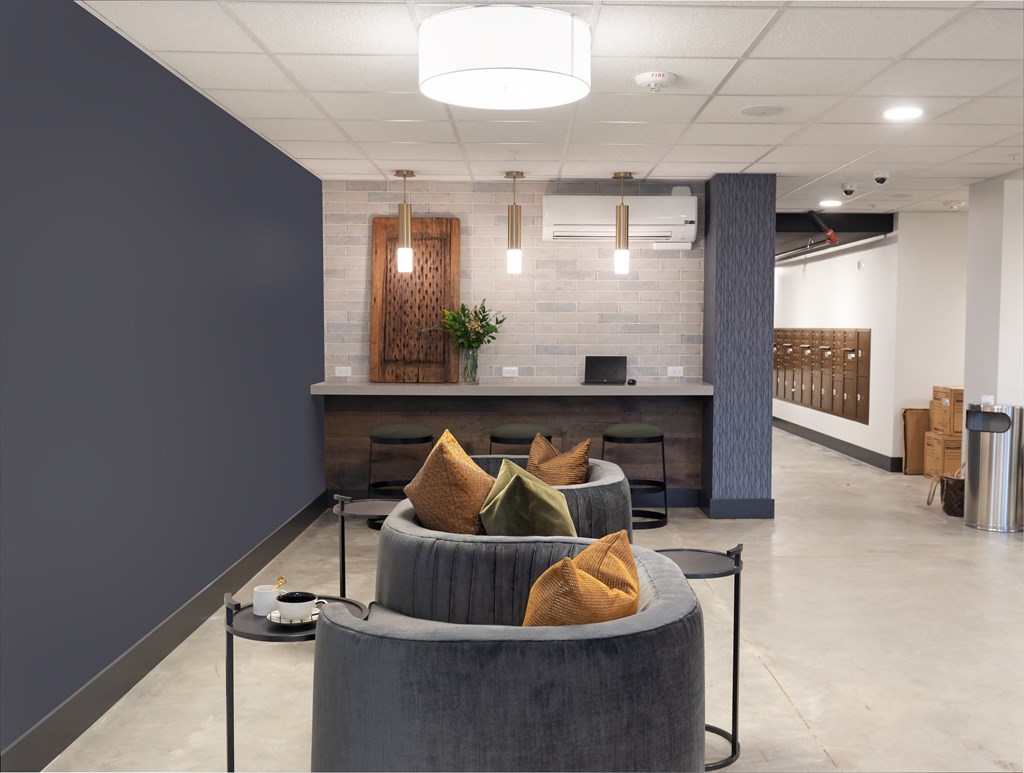 a living room with a couch and a table in a lobby