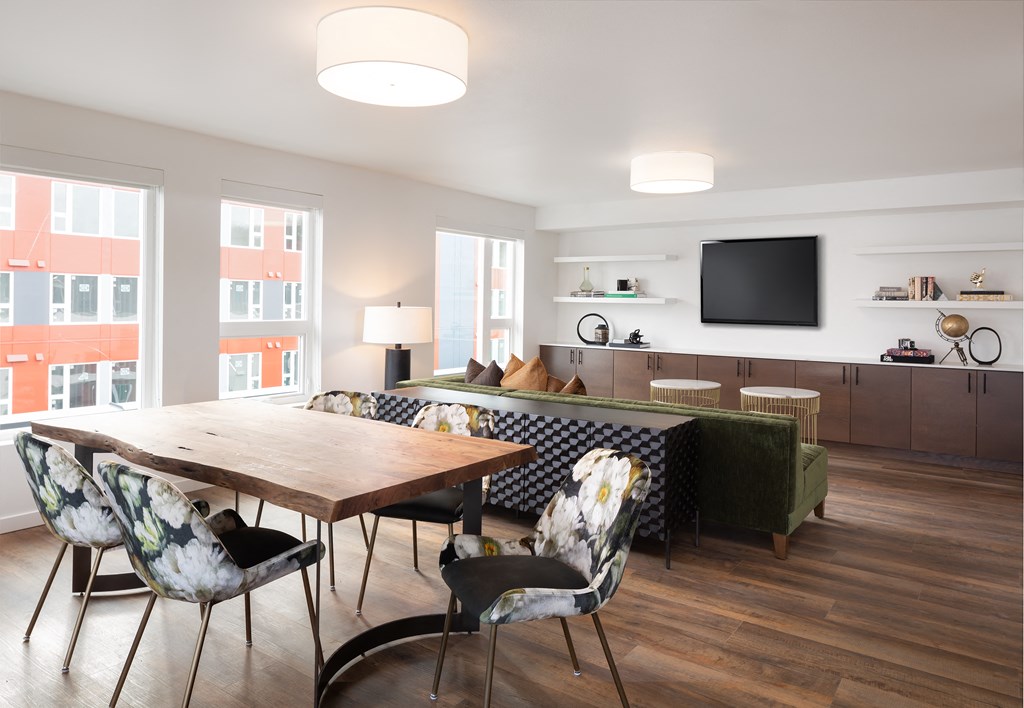 a living room with a table and chairs and a couch
