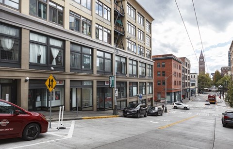 A city street with cars and buildings.