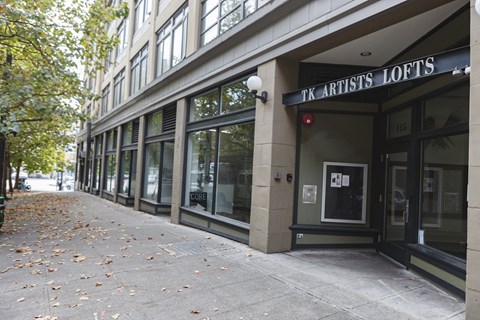 A building with a sign that says TK Artists Lofts.
